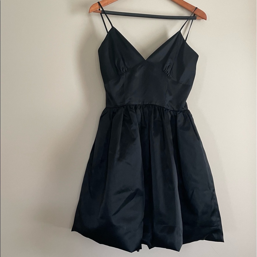 Baby doll satin black dress with bubble hem